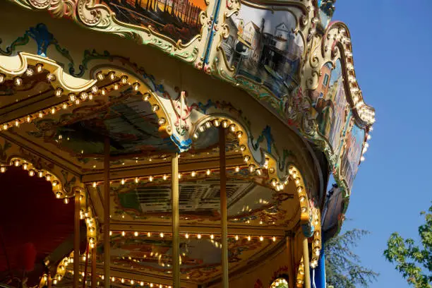 Photo of Details of a traditional Venetian carousel at the funfair.Carousel, traditional fairground ride.