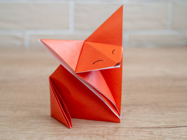 istock Orange fox via origami technique. DIY concept. Children's creativity. 1220058279
