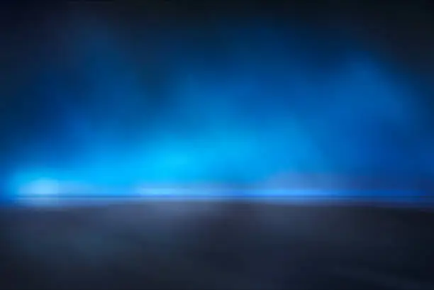 Photo of Abstract blue mist studio background.