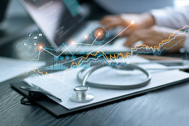 Healthcare business graph data and growth, Stethoscope with doctor's health report clipboard on table, Medical examination and doctor analyzing medical report on laptop screen. Healthcare business graph data and growth, Stethoscope with doctor's health report clipboard on table, Medical examination and doctor analyzing medical report on laptop screen. stethoscope photos stock pictures, royalty-free photos & images