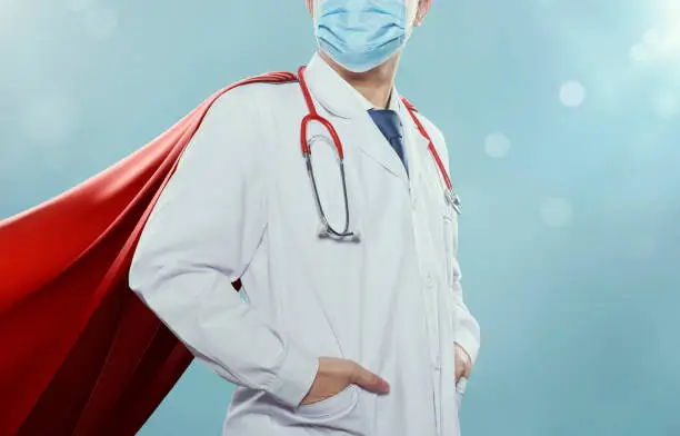 Photo of Closeup Doctor with mask and cape hero