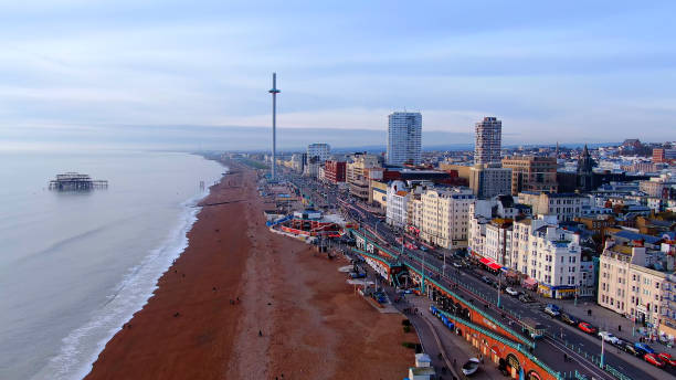 Brighton Pier in England - aerial view Brighton Pier in England - aerial view -aerial photography east sussex photos stock pictures, royalty-free photos & images