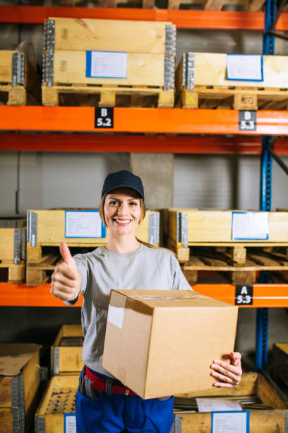 istock Young female manual worker standing inside warehouse 1220066863