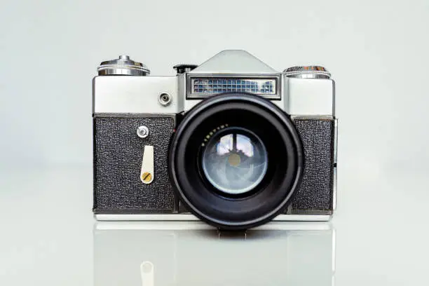 Photo of A soviet union camera Zenit E produced in 60s and 80s as an analogue to the German Leica. Very old film camera in shabby shape.