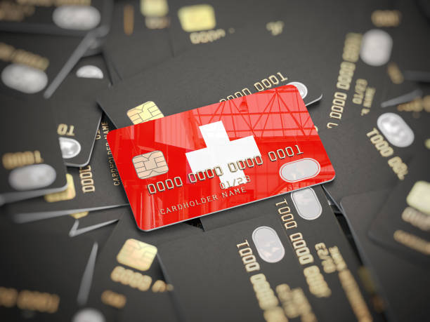 Credit card of swiss bank on the heap of other different black cards. Opening a bank account in Switzerland. Credit card of swiss bank on the heap of other different black cards. Opening a bank account in Switzerland. 3d illustration swiss culture stock pictures, royalty-free photos & images