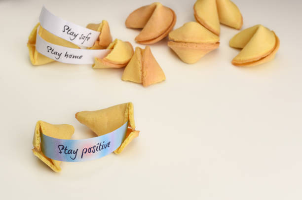 istock Stay positive wish in opened Chinese fortune cookie. 1220068524