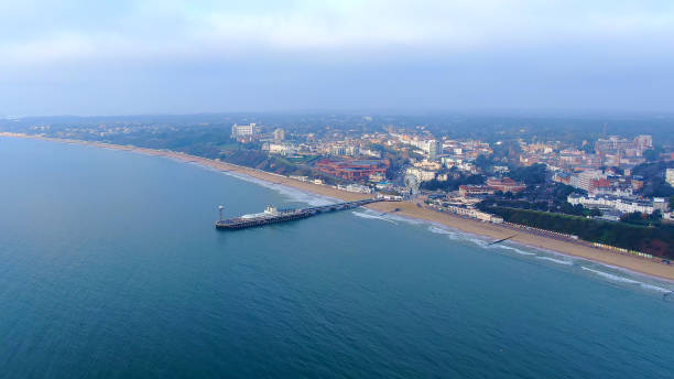 Bournemouth beach and pier in England Bournemouth beach and pier in England -aerial photography boscombe photos stock pictures, royalty-free photos & images