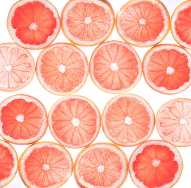 istock Close up of a sliced fresh grapefruit ,Slice of red grapefruit isolated on white background 1220069817