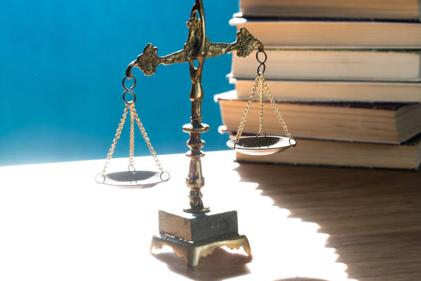 istock Concept of justice. Law scales on blue background. 1220070829