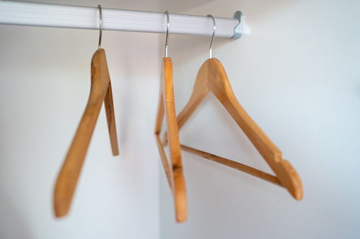 Wooden hangers on a rod