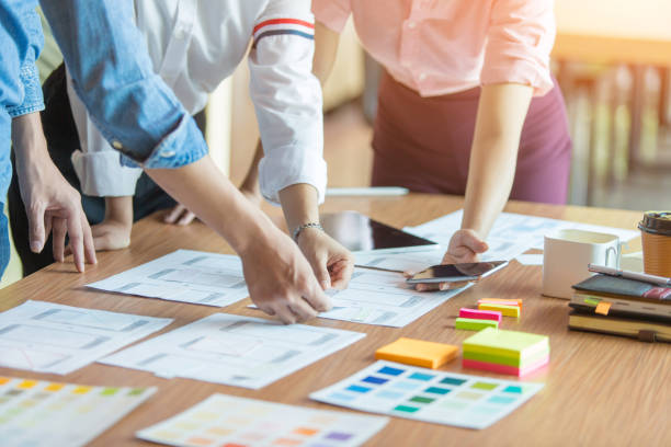 istock Graphic designers are brainstorming ideas in Choosing color groups to design applications for websites 1220074569