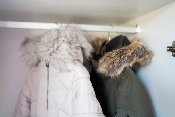istock Man's and woman's jacket hanging in the closet 1220074587