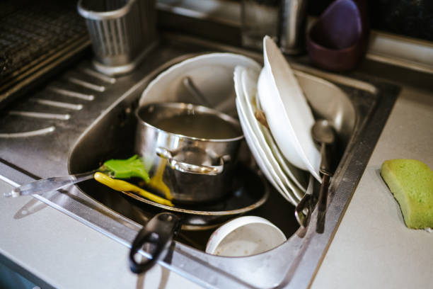 istock Dirty dishes in the sink 1220074703