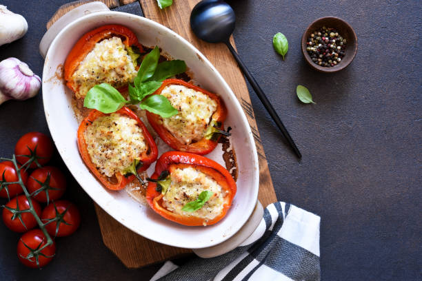 istock Baked bell pepper with meat and rice on a concrete dark background. 1220076626