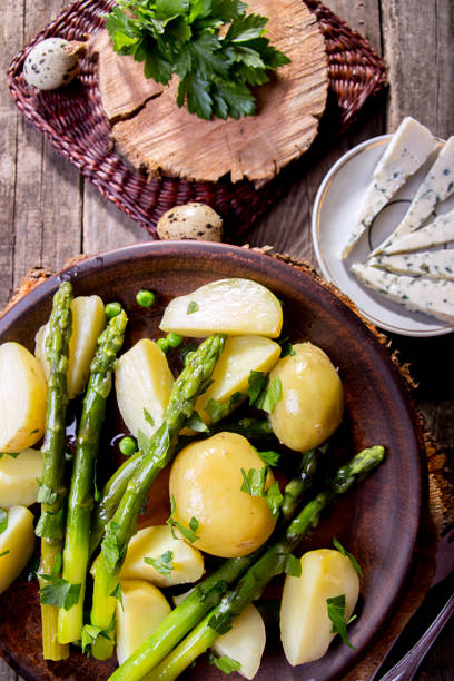 istock Boiled potato with grilled green asparagus 1220079479