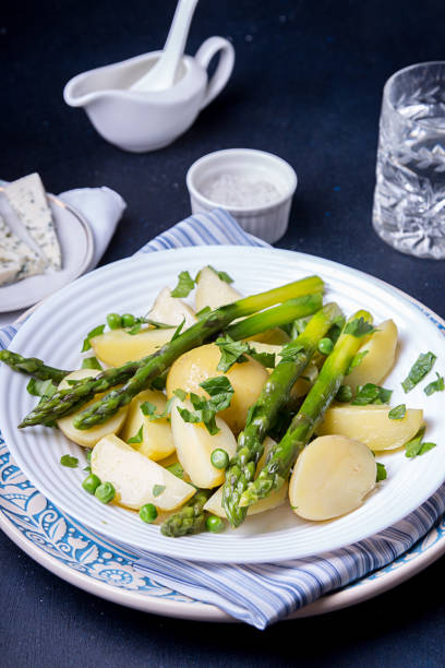 istock Boiled potato with grilled green asparagus 1220079481