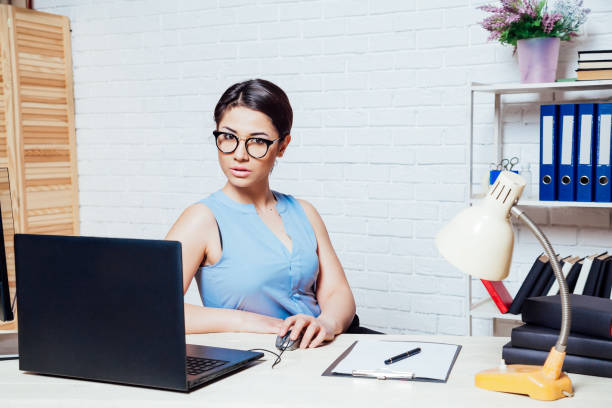 istock the girl works in an Office at a computer 1220079522