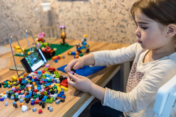 istock Little girl learning from home. 1220079668