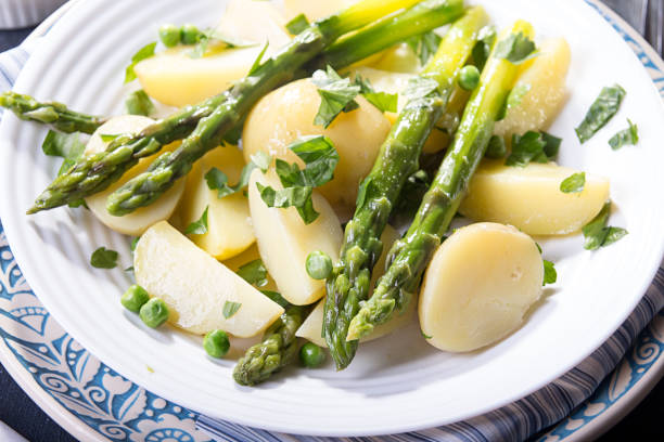 istock Boiled potato with grilled green asparagus 1220079676