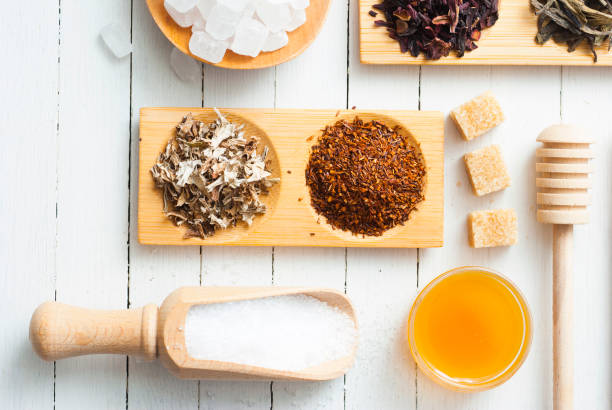 Tea variations tea crop and sugar sample variation on white wood texture background nub stock pictures, royalty-free photos & images