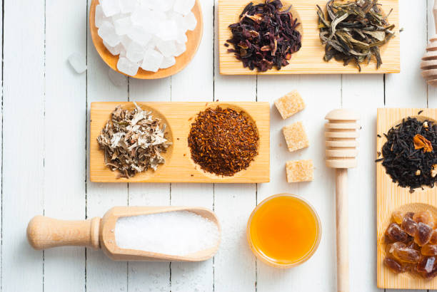 Tea variations tea crop and sugar sample variation on white wood texture background nub stock pictures, royalty-free photos & images