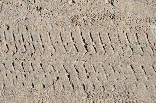 Tyre (tire) track on yellow sand