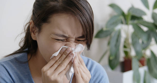 istock woman sick at home 1220083323