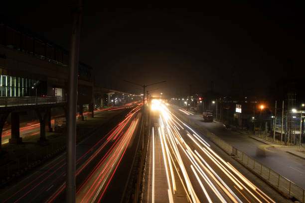 istock Speed Traffic light trails on highway, long exposure, urban background and dark sky 1220083352