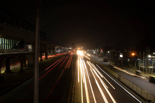 istock Speed Traffic light trails on highway, long exposure, urban background and dark sky 1220083360