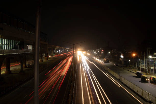 istock Speed Traffic light trails on highway, long exposure, urban background and dark sky 1220083378