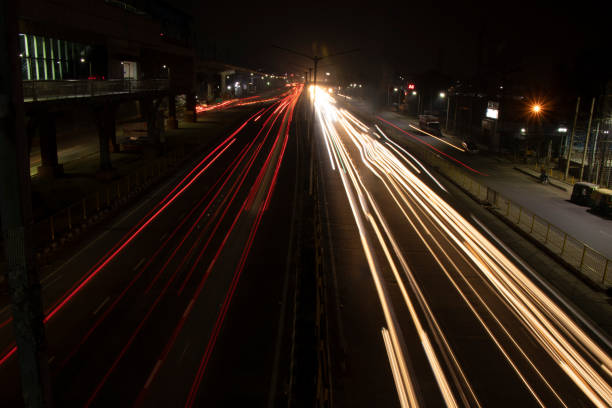 istock Speed Traffic light trails on highway, long exposure, urban background and dark sky 1220083407