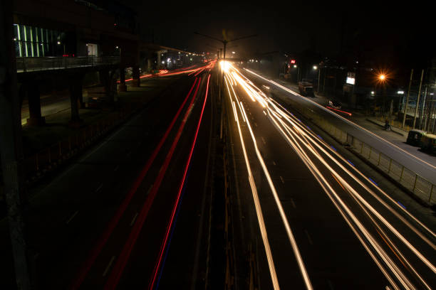 istock Speed Traffic light trails on highway, long exposure, urban background and dark sky 1220083442