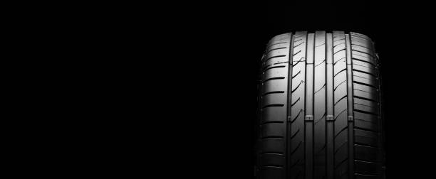istock summer tire on a black background. space for text, copy space panorama 1220086933