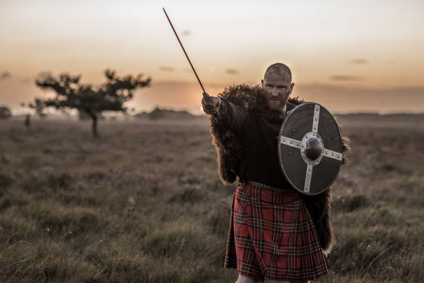 istock Scottish Redhead Warrior wearing a kilt 1220088763