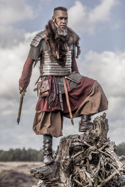 An individual viking warrior man on highland moors during a battle