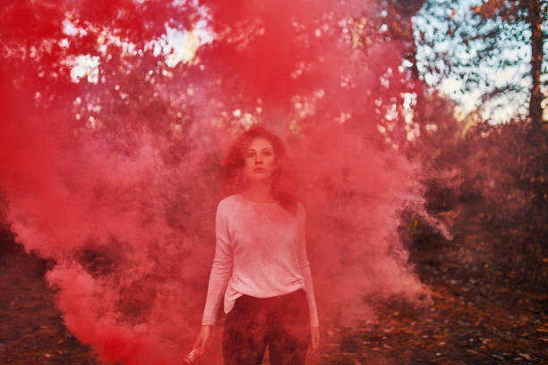 istock Woman smoke screen in the woods. 1220091686