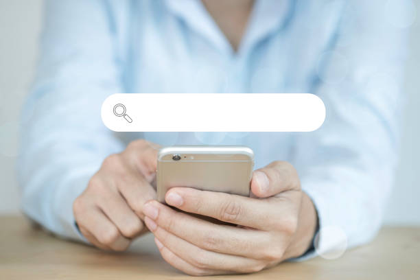 istock Businessman touching on smart mobile phone for input wording and searching from web browser. Technology with copy space concept. 1220093445