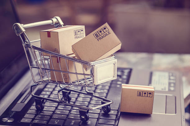 Boxes in a shopping cart on a laptop keyboard
