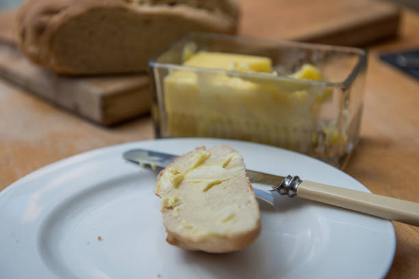 istock Slice of bread and butter 1220095195