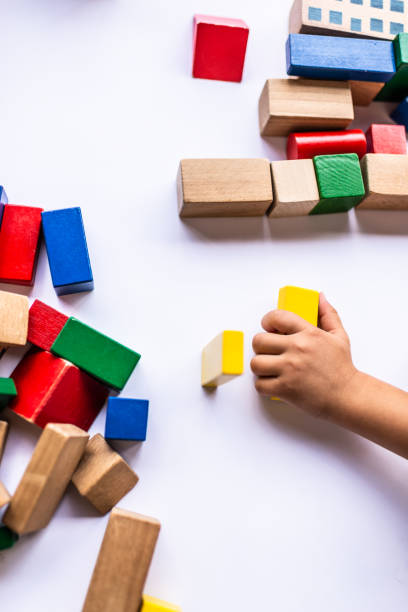 istock High angle view of a children hands playing with colorful building blocks 1220097105
