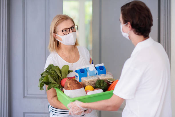 istock Food delivery during virus outbreak. Face mask. 1220099075