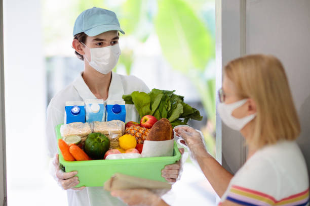 istock Food delivery during virus outbreak. Face mask. 1220099233