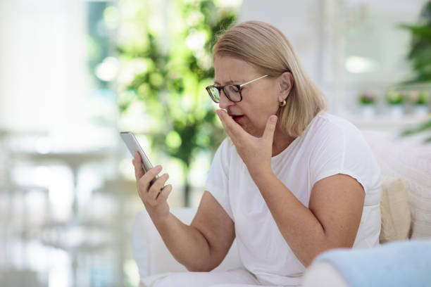 istock Sick woman in face mask calling doctor. 1220100513