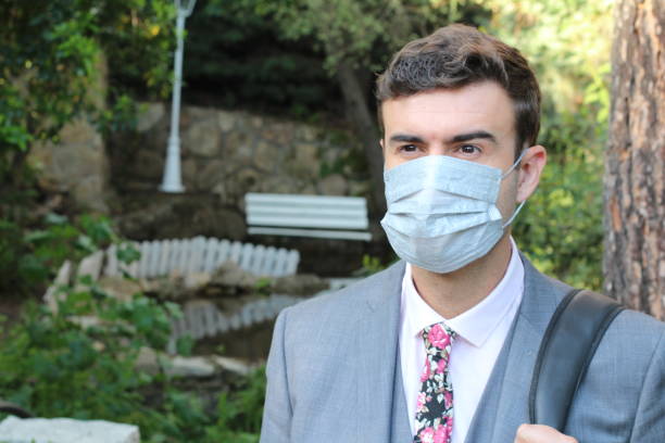 istock Businessman wearing stylish outfit with matching protective mask 1220100751