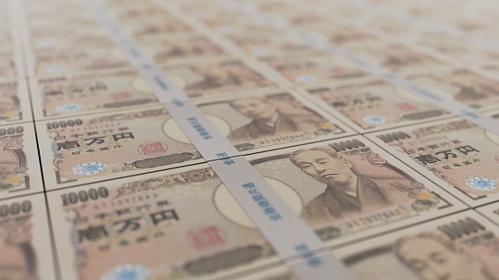 A neatly aligned Japanese wad of 10,000 yen bills
