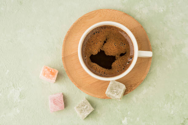 istock colorful Turkish delights and coffee on green with copy space 1220102069
