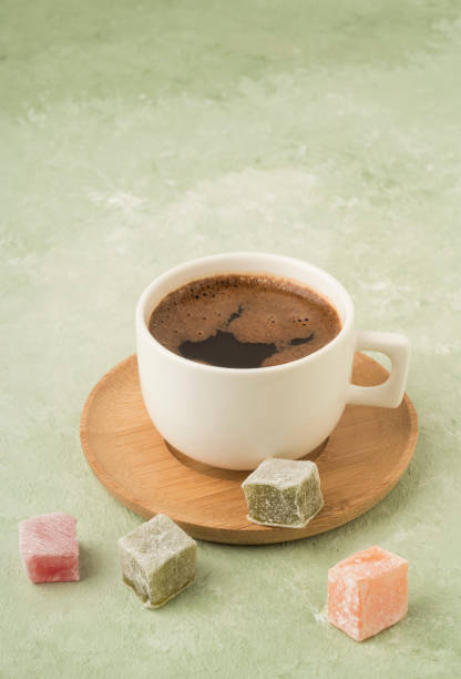 istock Turkish delights and coffee on green with copy space 1220102070
