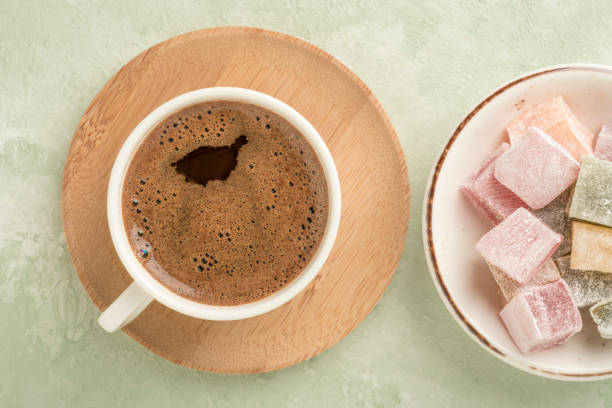istock Turkish delights and coffee on green with copy space 1220102078