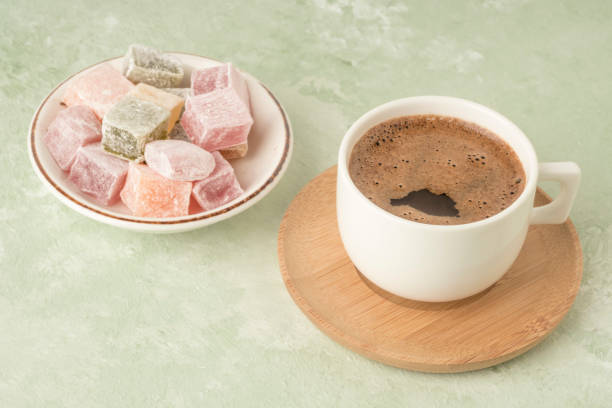 istock Turkish delights and coffee on green with copy space 1220102080