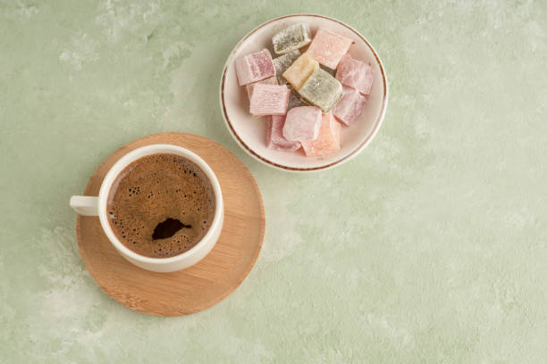 istock Turkish delight and coffee on green with copy space 1220102081